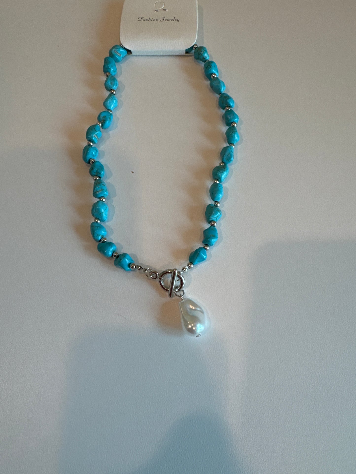 TURQUOISE NECKLACE WITH WHITE PEARL LIKE CHARM